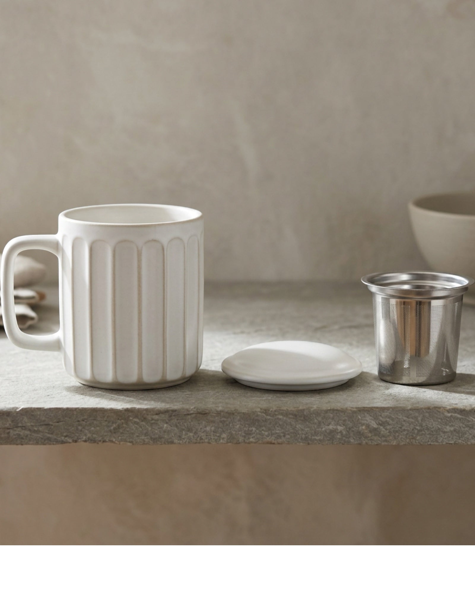 Ymvbf Ribbed Cylinder Ceramic Tea Cup with Slot Infuser and Lid 13 oz Clay Oat - Lifestyle view